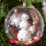 Round ornament with a snowman inside